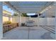Backyard patio area with grill, bench, and rock feature along block wall at 21325 S 201St Way, Queen Creek, AZ 85142