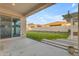 Covered patio with grassy backyard and block wall, great for outdoor living at 21325 S 201St Way, Queen Creek, AZ 85142