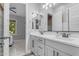 Bathroom with double vanity, stylish mirror, and access to bedroom at 21325 S 201St Way, Queen Creek, AZ 85142