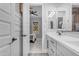 Bathroom vanity area that connects to a bedroom with a ceiling fan at 21325 S 201St Way, Queen Creek, AZ 85142