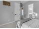 Minimalist bedroom with ensuite bath access and basketball hoop decor at 21325 S 201St Way, Queen Creek, AZ 85142