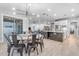 Open concept dining room connected to the kitchen featuring bright lighting and airy layout at 21325 S 201St Way, Queen Creek, AZ 85142