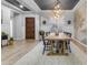 Elegant dining room showcasing a rustic wood table, statement lighting, and stylish decor at 21325 S 201St Way, Queen Creek, AZ 85142
