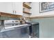 Clean and organized laundry room featuring modern washer and dryer set at 21325 S 201St Way, Queen Creek, AZ 85142