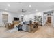 Bright living room with hardwood floors, shiplap walls, and stylish furniture at 21325 S 201St Way, Queen Creek, AZ 85142