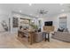 Inviting living room featuring shiplap walls, hardwood floors, modern furniture and backyard access at 21325 S 201St Way, Queen Creek, AZ 85142
