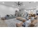 Spacious living room featuring neutral decor, two sofas, hardwood floors, and plenty of natural light at 21325 S 201St Way, Queen Creek, AZ 85142