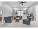 Inviting living room with plush gray sectional, modern furniture, and decor at 21325 S 201St Way, Queen Creek, AZ 85142