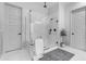 Sleek main bathroom with a glass enclosed shower, white tile, and modern fixtures at 21325 S 201St Way, Queen Creek, AZ 85142