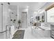Spa-like main bathroom featuring a soaking tub, glass shower, and double vanity at 21325 S 201St Way, Queen Creek, AZ 85142