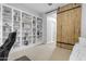 Bright office space featuring built in bookshelves and barn door access at 21325 S 201St Way, Queen Creek, AZ 85142
