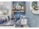 Stylish home office space with accent wall, shelving, and modern desk at 21325 S 201St Way, Queen Creek, AZ 85142