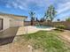 Sprawling backyard with pool, covered patio, and lush landscaping at 2201 W Avalon Dr, Phoenix, AZ 85015