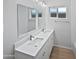 Bright bathroom features double sinks, sleek fixtures, and modern lighting with a light and airy feel at 2201 W Avalon Dr, Phoenix, AZ 85015