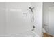 Bathroom featuring a tiled shower, tub, and niche, offering a clean, modern aesthetic at 2201 W Avalon Dr, Phoenix, AZ 85015