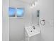 Modern bathroom showcasing a sleek vanity, window, and ample lighting at 2201 W Avalon Dr, Phoenix, AZ 85015