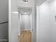 Bright bathroom with modern white tile and an open hallway at 2201 W Avalon Dr, Phoenix, AZ 85015