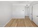 Neutral bedroom featuring wood floors and an open doorway at 2201 W Avalon Dr, Phoenix, AZ 85015