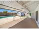 Covered patio overlooking a fenced pool and spacious backyard at 2201 W Avalon Dr, Phoenix, AZ 85015