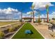 Community park offering recreational spaces including playground, cornhole, and covered seating areas at 2522 E Presidio St, Mesa, AZ 85213