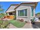View of the rear of the house with a covered patio, hot tub, and landscaped backyard at 2623 E Marcos Dr, Casa Grande, AZ 85194