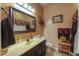Bathroom with tiled floors, single vanity and decorative accessories and decor at 2623 E Marcos Dr, Casa Grande, AZ 85194