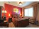 Elegant bedroom with a decorative headboard, plush bedding, and bright natural light at 2623 E Marcos Dr, Casa Grande, AZ 85194