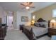 Spacious bedroom with a large bed, plush carpet, and neutral wall paint at 2623 E Marcos Dr, Casa Grande, AZ 85194