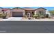 Charming single-Gathering home with a well-manicured front yard, desert landscaping, and a two-car garage at 2623 E Marcos Dr, Casa Grande, AZ 85194