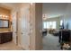 Hallway with an open view to a tiled bathroom and a carpeted main bedroom at 2623 E Marcos Dr, Casa Grande, AZ 85194