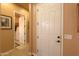 Hallway shows neutral paint, decorative artwork, and an inviting path to other rooms at 2623 E Marcos Dr, Casa Grande, AZ 85194