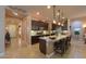 Open kitchen with granite countertops, stainless steel appliances, and dark wood cabinetry at 2623 E Marcos Dr, Casa Grande, AZ 85194