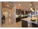 Bright kitchen with stainless steel appliances, granite countertops, and dark wood cabinetry at 2623 E Marcos Dr, Casa Grande, AZ 85194