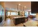 Open kitchen with stainless steel appliances, granite countertops, and island at 2623 E Marcos Dr, Casa Grande, AZ 85194