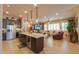 Open kitchen with stainless steel appliances, granite countertops, and dark wood cabinetry at 2623 E Marcos Dr, Casa Grande, AZ 85194