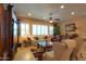 Bright and inviting living room with a ceiling fan, recessed lighting, and plenty of seating at 2623 E Marcos Dr, Casa Grande, AZ 85194