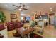 Living room with a ceiling fan, recessed lighting, and plenty of seating at 2623 E Marcos Dr, Casa Grande, AZ 85194