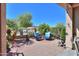 Private brick-paved patio area with lush landscaping and comfortable seating at 2623 E Marcos Dr, Casa Grande, AZ 85194