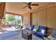 Covered patio with outdoor seating, a ceiling fan, and charming decor at 2623 E Marcos Dr, Casa Grande, AZ 85194