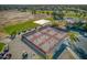 Aerial view of the community pickleball courts with golf carts and landscaping at 2623 E Marcos Dr, Casa Grande, AZ 85194