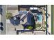 Aerial view of a home with solar panels, a swimming pool, a hot tub, and manicured landscaping at 31918 N Caspian Way, San Tan Valley, AZ 85143