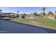Expansive backyard featuring a well-manicured lawn, RV Parking, pool, hot tub and a covered patio area at 31918 N Caspian Way, San Tan Valley, AZ 85143