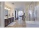 Bathroom with vanity, glass enclosed shower, and doorway leading into the home at 31918 N Caspian Way, San Tan Valley, AZ 85143