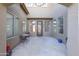 Enclosed courtyard with seating area and entry door surrounded by windows at 31918 N Caspian Way, San Tan Valley, AZ 85143