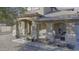 Charming covered porch with tasteful decor, potted plants, and a welcoming ambiance at the home's entrance at 31918 N Caspian Way, San Tan Valley, AZ 85143
