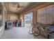 Organized garage space with a ceiling fan, ample work space, and an RV parked outside at 31918 N Caspian Way, San Tan Valley, AZ 85143