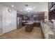 Spacious kitchen with stainless steel appliances, granite countertops, a center island, and wooden cabinets at 31918 N Caspian Way, San Tan Valley, AZ 85143