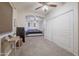 Large primary bedroom with a ceiling fan, a walk-in closet, and an en-suite bathroom at 31918 N Caspian Way, San Tan Valley, AZ 85143