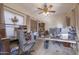 Home office space featuring dual desks, carpet floors, and a ceiling fan at 31918 N Caspian Way, San Tan Valley, AZ 85143