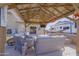Inviting covered patio area features comfortable seating, a fire pit, and a clear view of the RV at 31918 N Caspian Way, San Tan Valley, AZ 85143